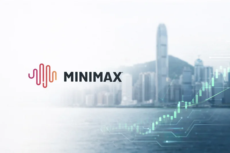 MiniMax, rival da DeepSeek, lidera nova vaga de IPOs de IA na China Logótipo da MiniMax com skyline financeiro de Hong Kong e gráfico de bolsa em alta, simbolizando a nova vaga de IPOs de IA na China.